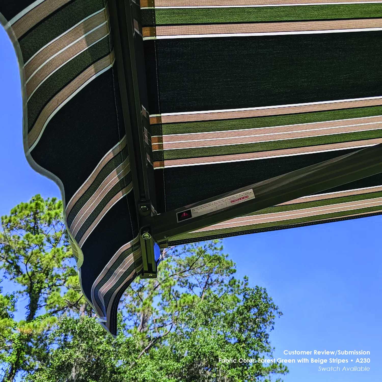 A230 Striped awning with green and beige pattern against a blue sky with trees in the background