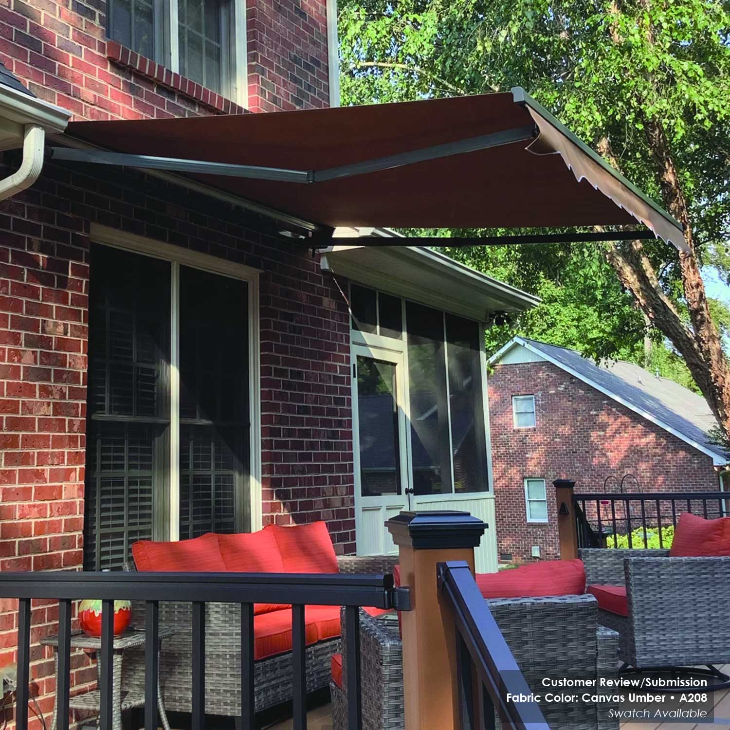 A208 retractable awning over outdoor furniture on a brick house porch.