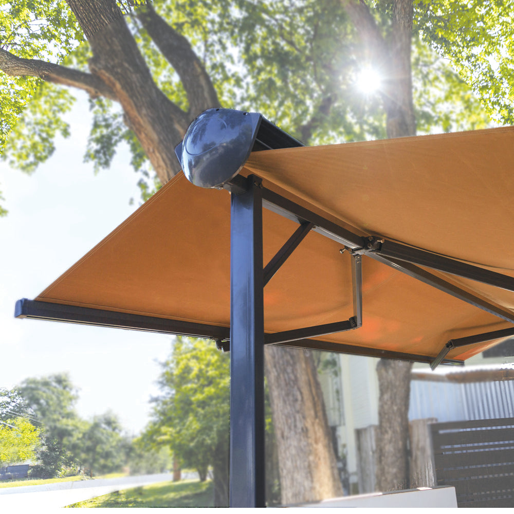 Advaning FS Series (Free Standing) dual-deploying awning with trees in the background