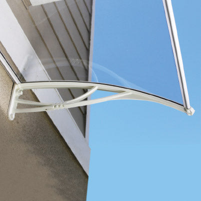 Metal awning bracket attached to a glass panel with a blue background