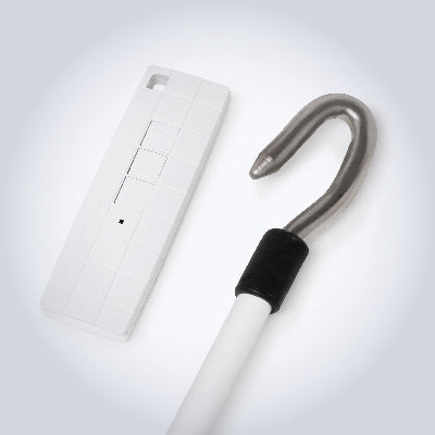 White cane with silver hook top on a white background