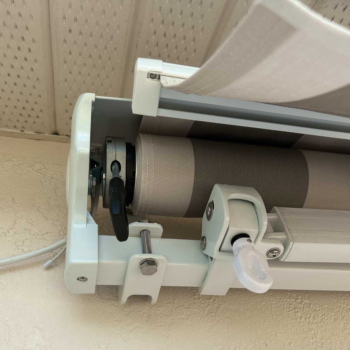 Close-up of a roller blind mechanism on a ceiling