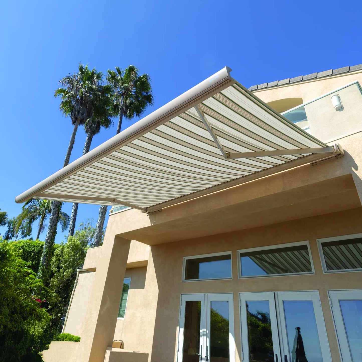 House exterior with a retractable awning on a clear day